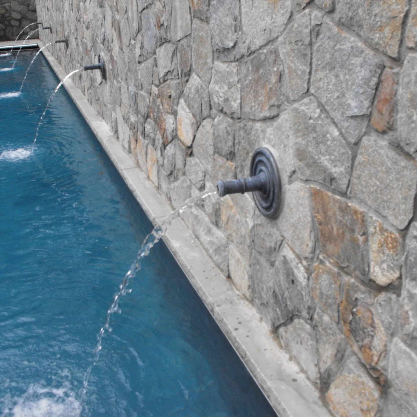 The Cannon Spout in action, adding a rhythmic elegance to this stunning lap pool 🌊✨.

Whether you're designing a sprawling estate or a sleek, modern pool area, our spouts provide the perfect architectural finish for high-end water features.

Archite
