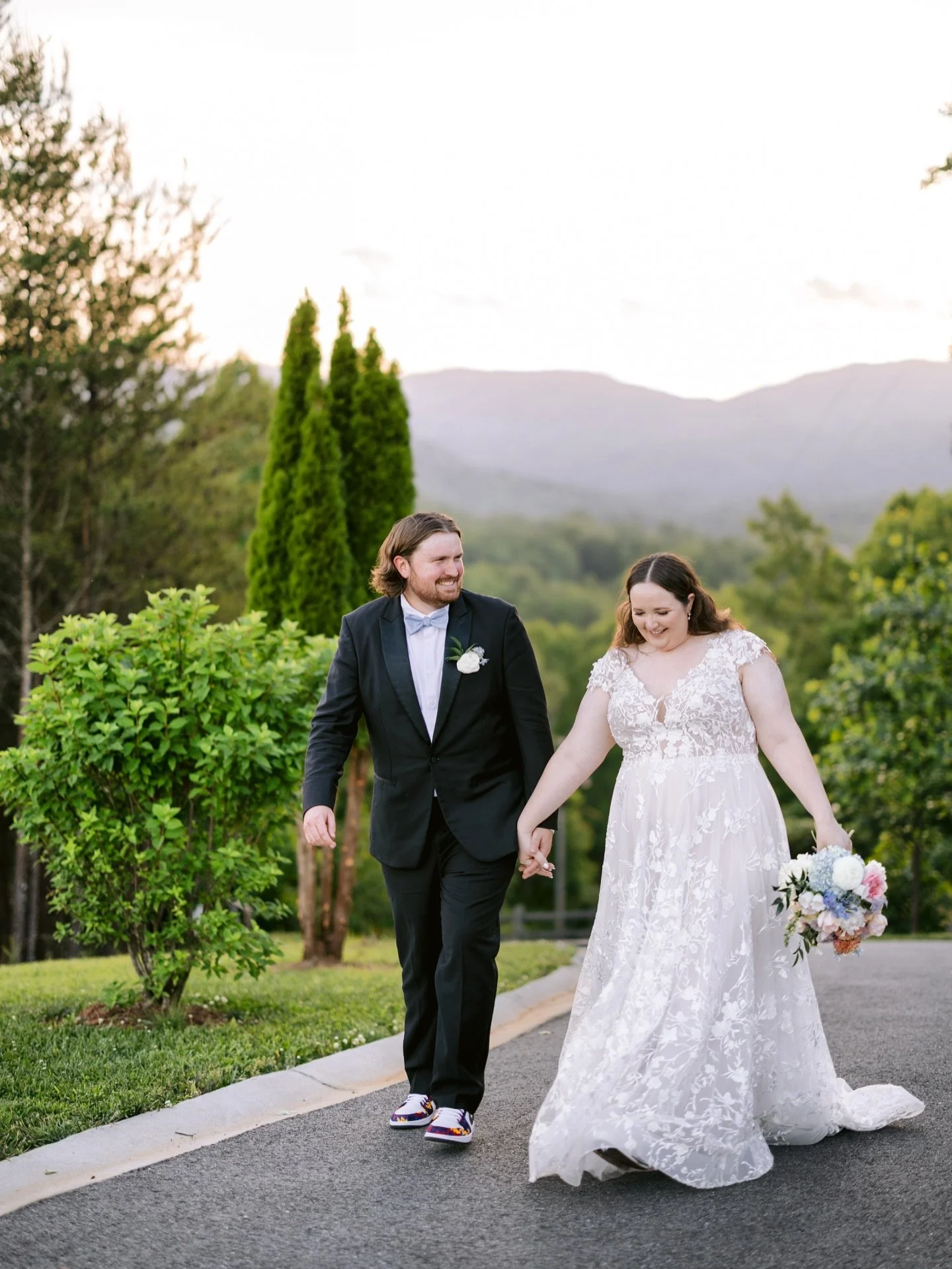 A glorious spring day between the Smokies + Blue Ridge &mdash; Zach &amp; Emily.

Zach and Emily&rsquo;s spring wedding was playful, beautiful, and full of personality &mdash; from sneakers made for dancing to an English garden&ndash;inspired aesthet