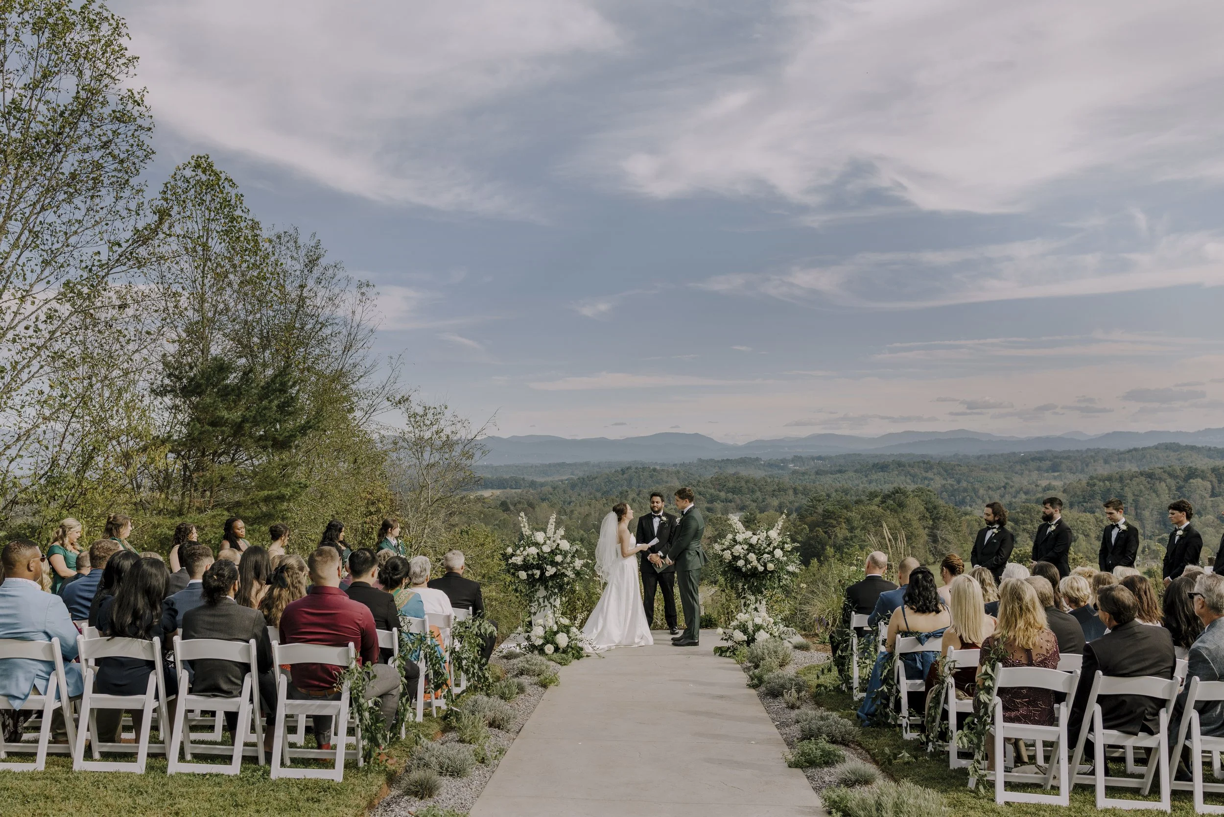 Wedding ceremony overlooking the Blue Ridge Mountains at Longleaf Vineyard in Western North Carolina