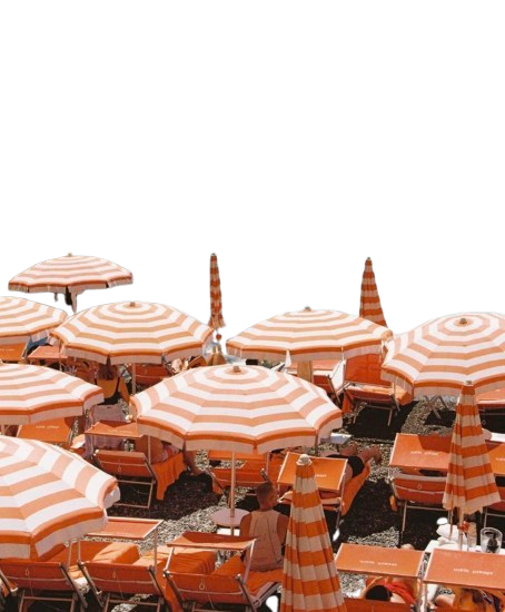 Orange and white striped beach umbrellas and lounge chairs on a pebble beach.