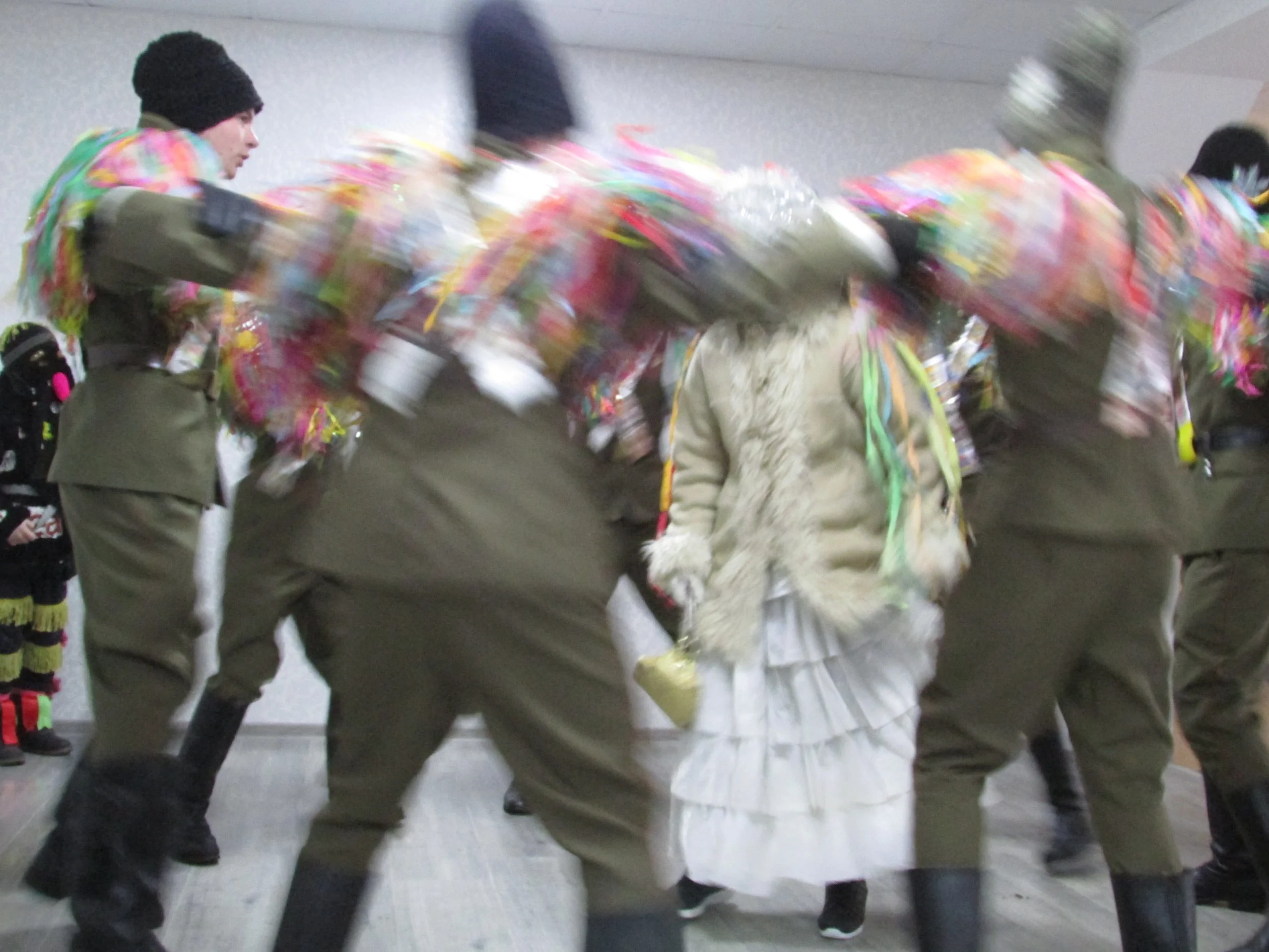   Malanca"kings" perform a lively dance around the "bride" .  