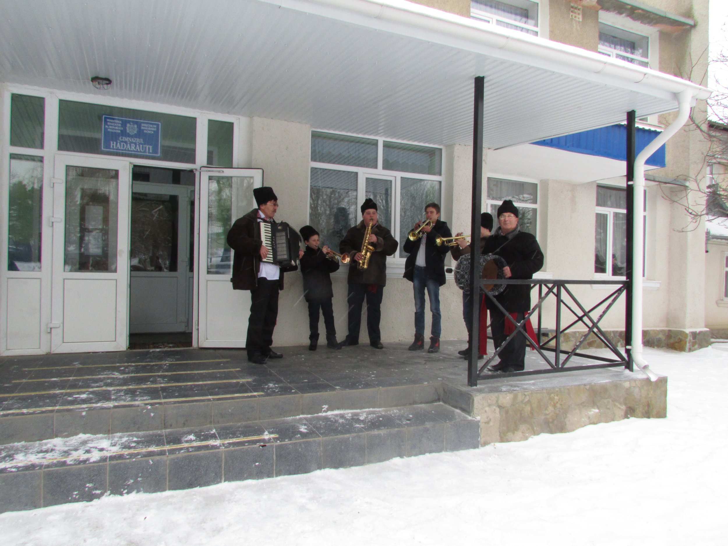   Hădărăuți musicians welcome guests to a show at the village school featuring local children's ensembles.  