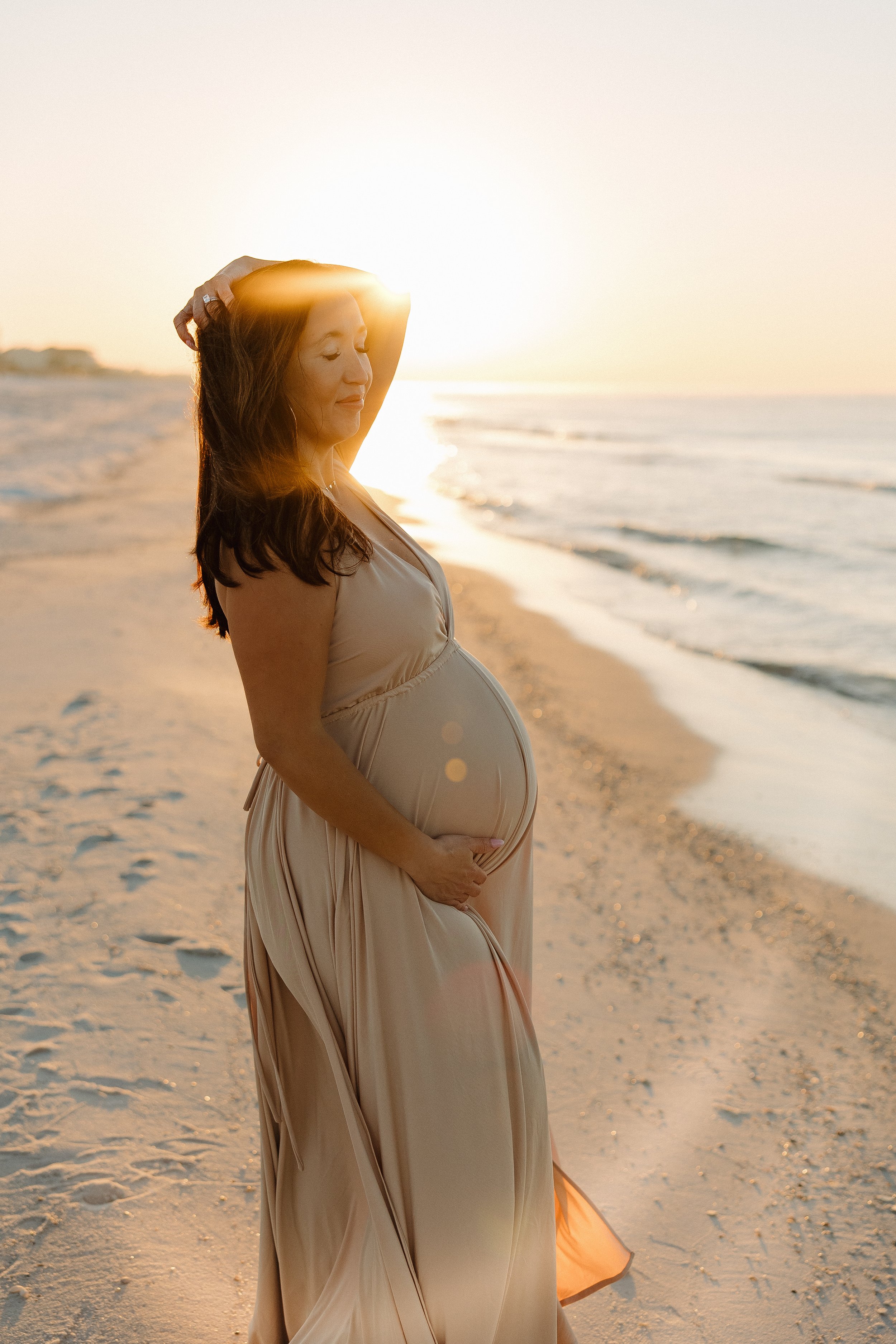 Dreamy golden hour maternity session showing a gorgeous bump in Edmond, Oklahoma.