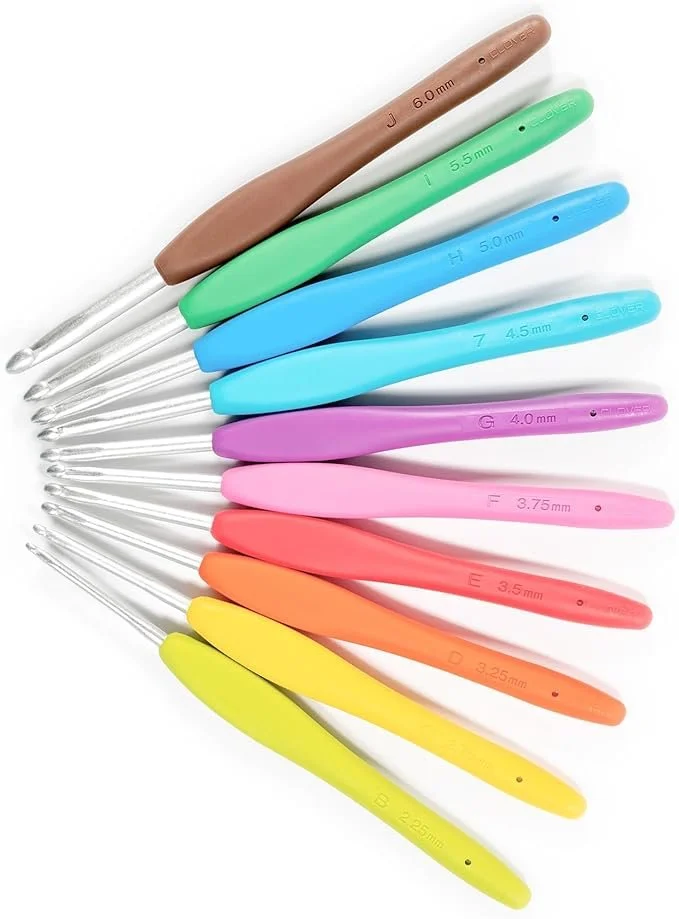 A set of colorful crochet hooks arranged in a fan shape, with sizes and measurements marked on each handle.
