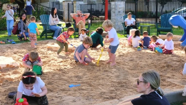 Sand play area at westbank community library, shade structure, nature play