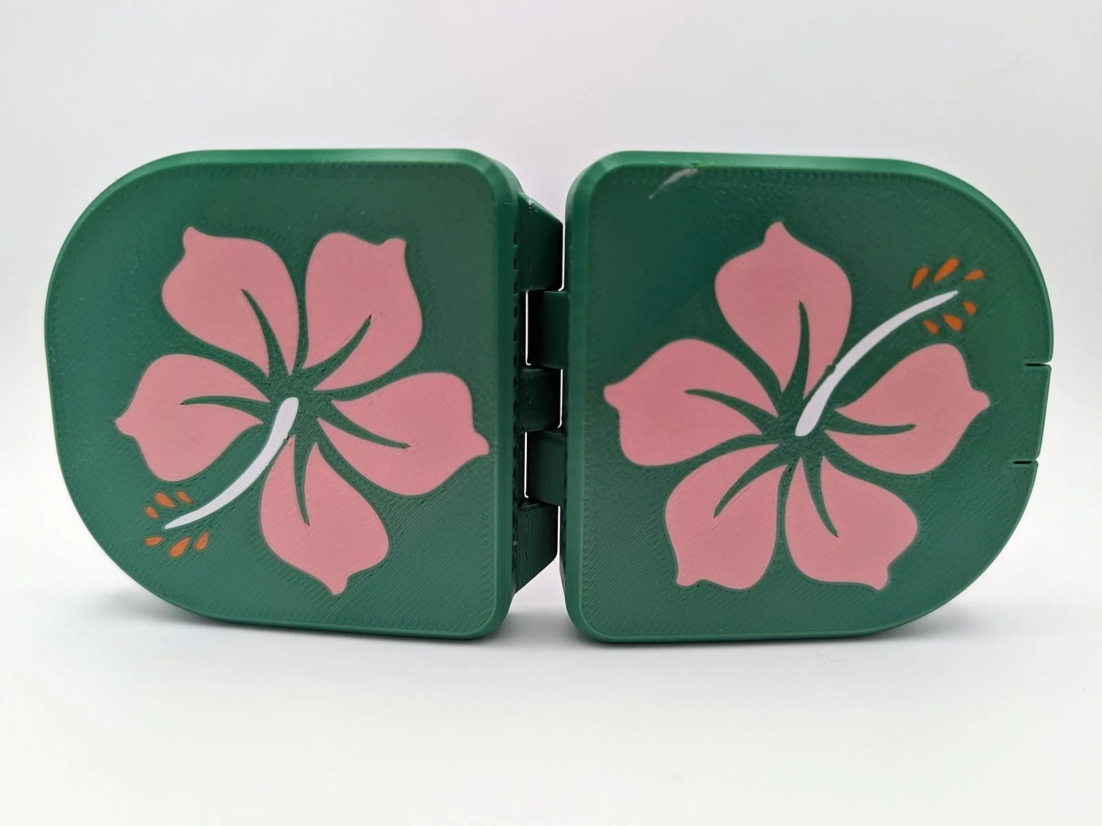 Green Pink Hibiscus mouthguard case shown open