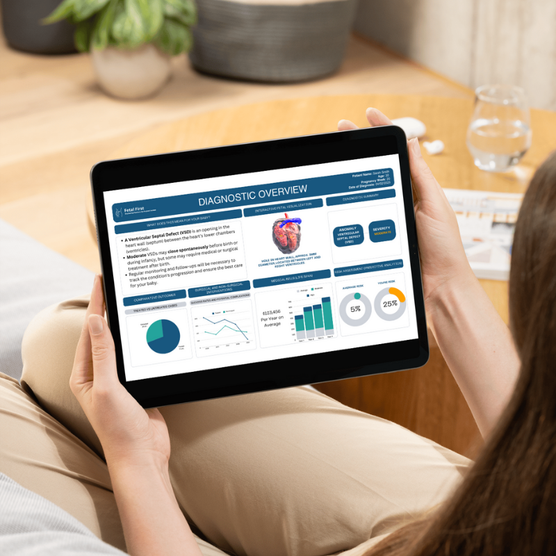 Person holding a tablet displaying a diagnostic overview related to Ventricular Septal Defect (VSD). The screen shows information on heart structure, interactive heart diagram, statistical graphs, medical results, and key insights.