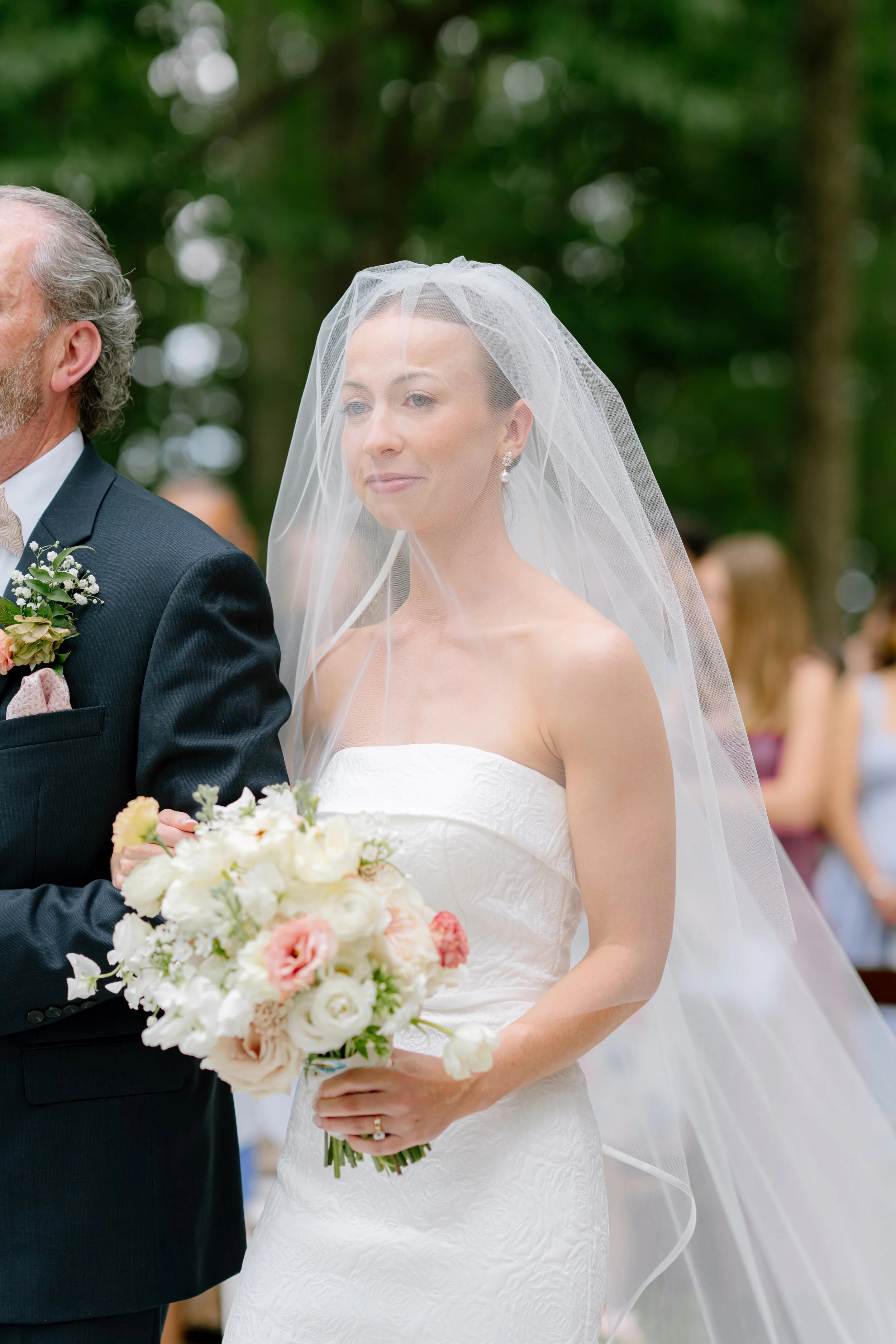 Woman is emotional as she sees her husband down the isle during a wedding ceremony in South Carolina