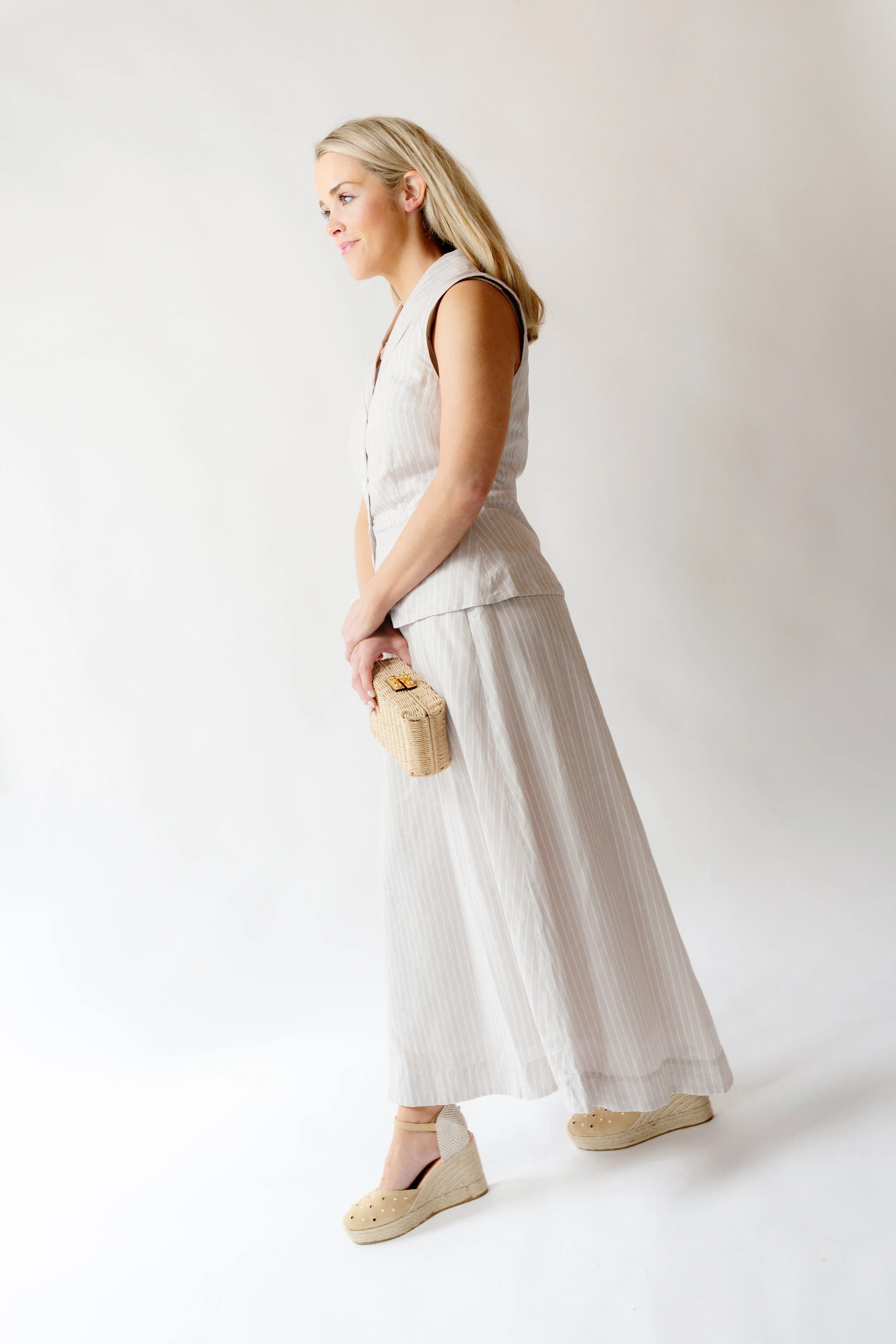 Editorial portrait photography by Chandler Cox — woman in linen outfit against white backdrop, Columbia SC personal branding and lifestyle photographer