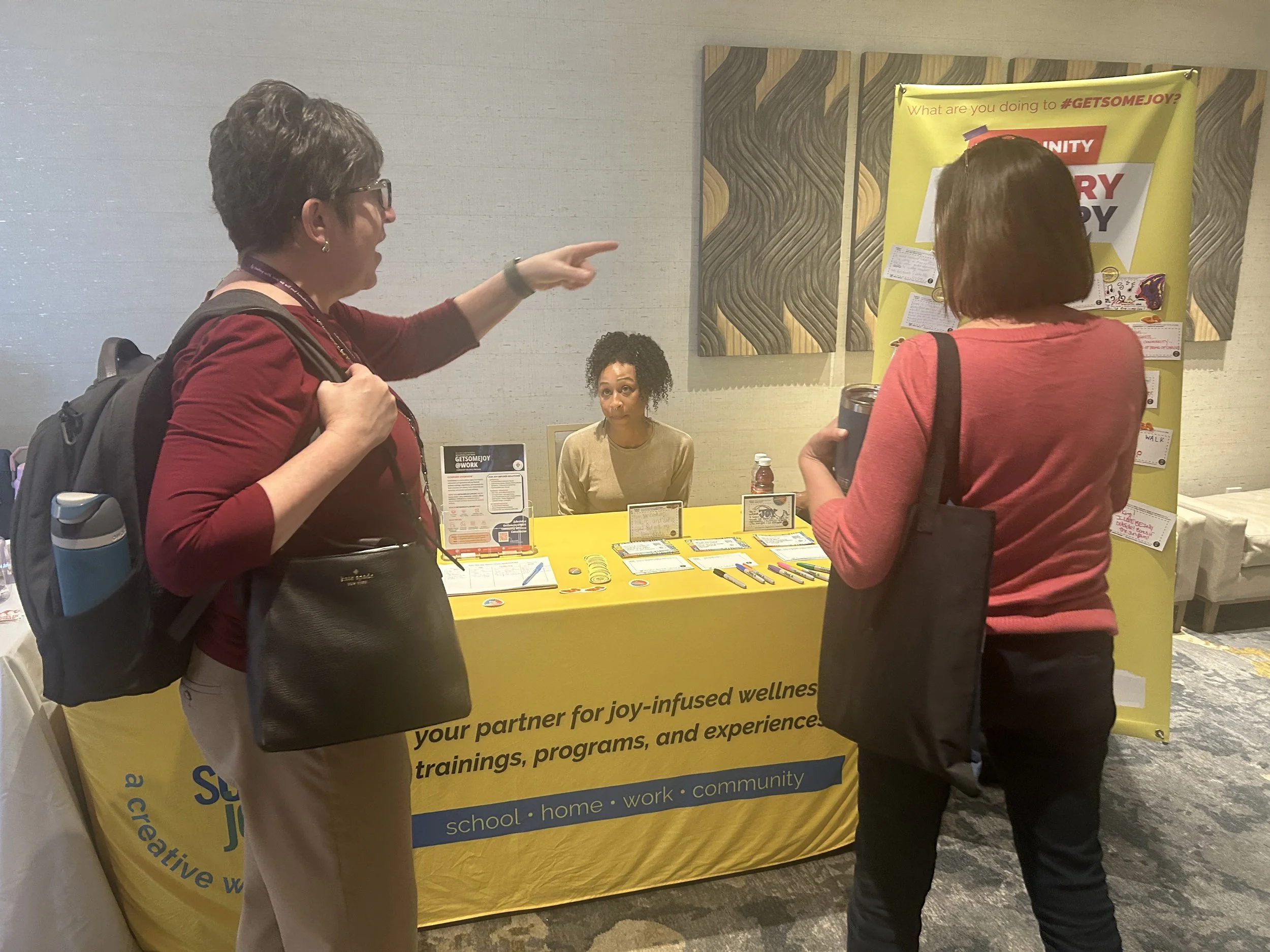 sd woman pointing @ LT wall.jpg