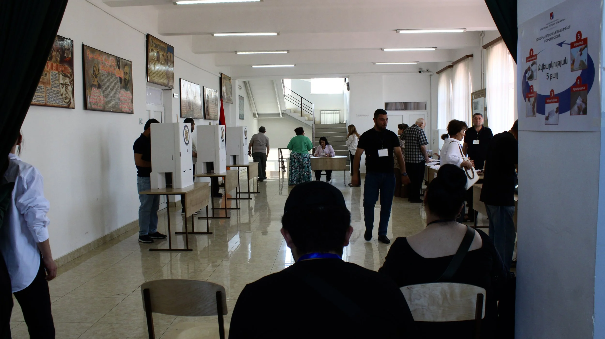Voters and election workers inside a polling site in the neighborhood of Sari Tagh on June 7, 2026. 