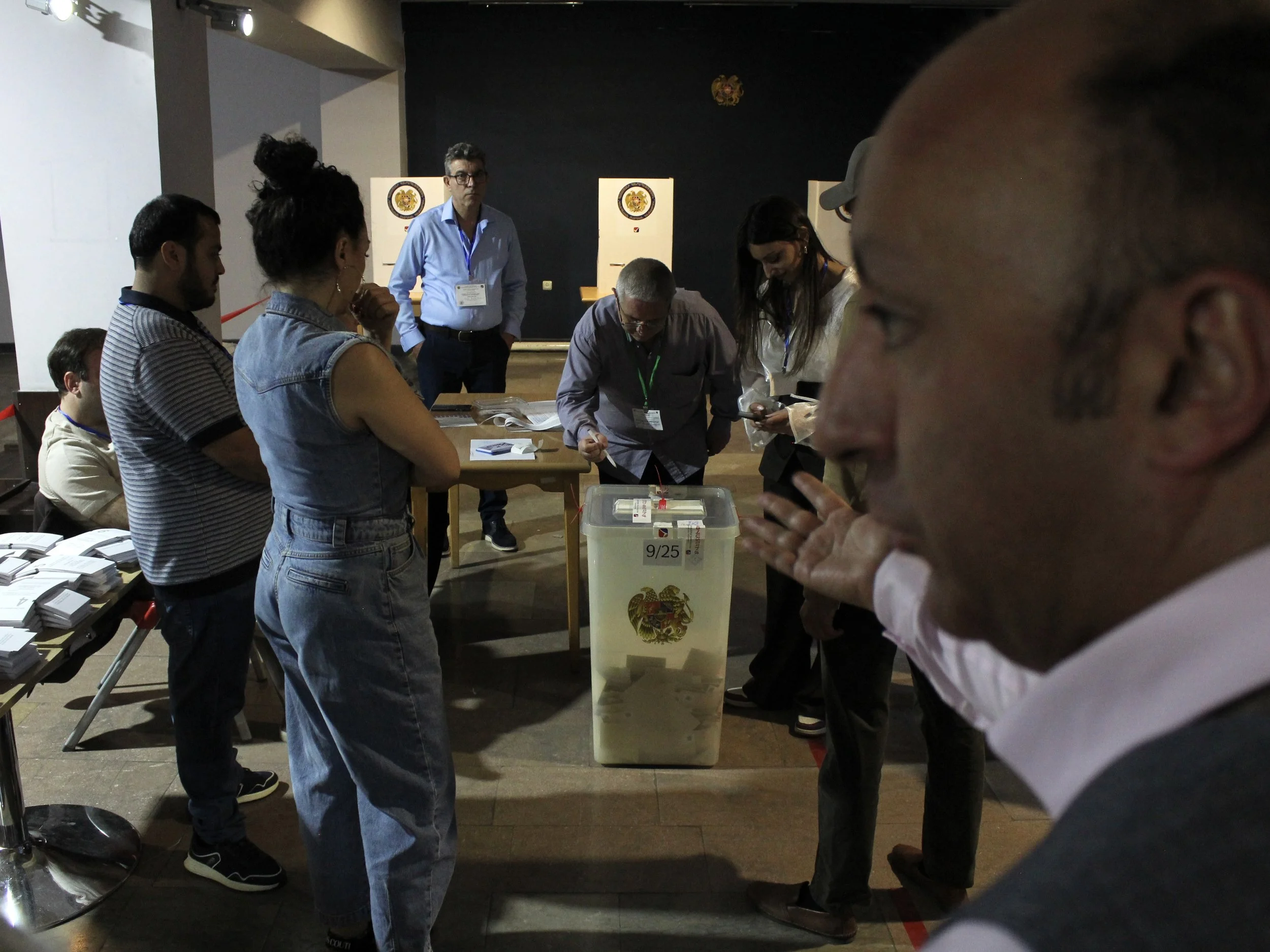 With election observers present, officials lock the ballot box after polls closed at 8 p.m. on June 7.