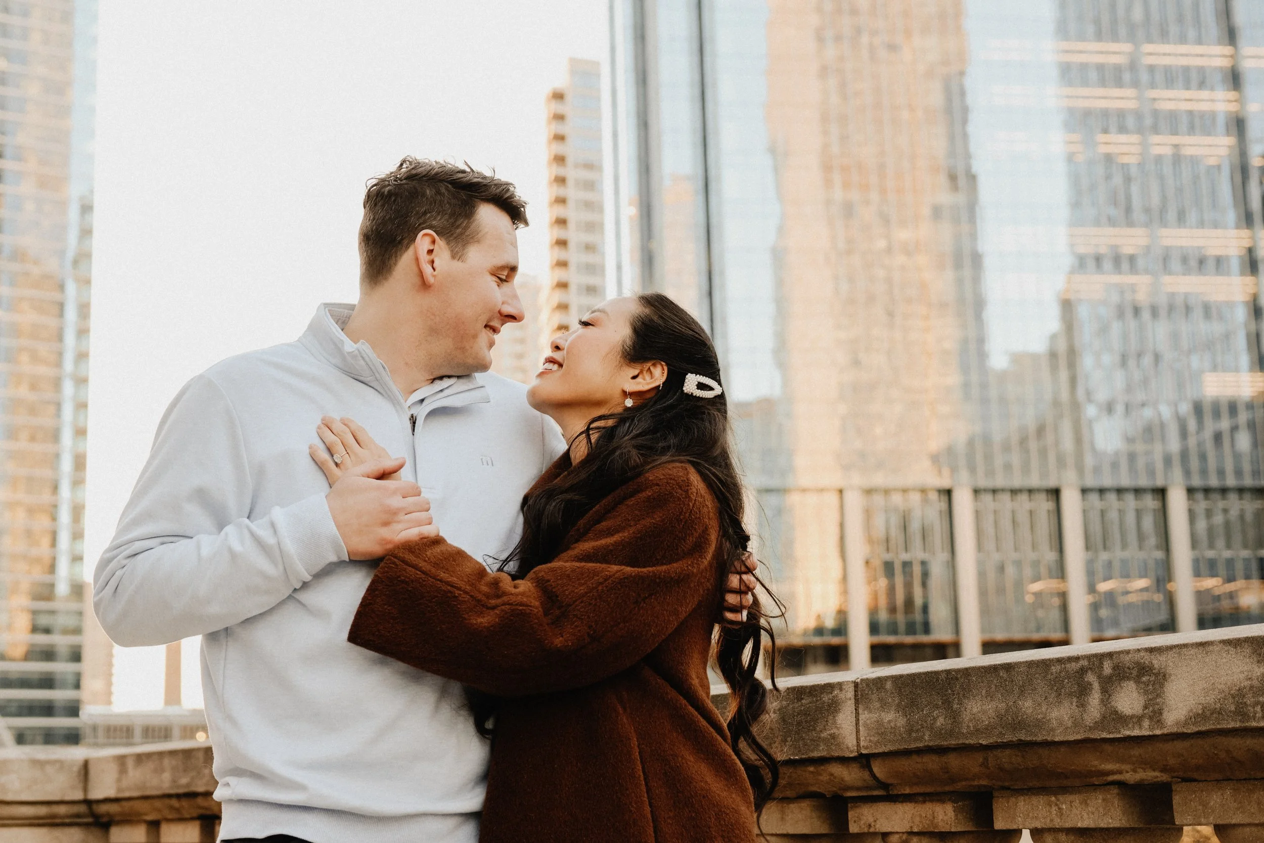 An engaged couple poses for photos in Chicago's River North neighborhood.