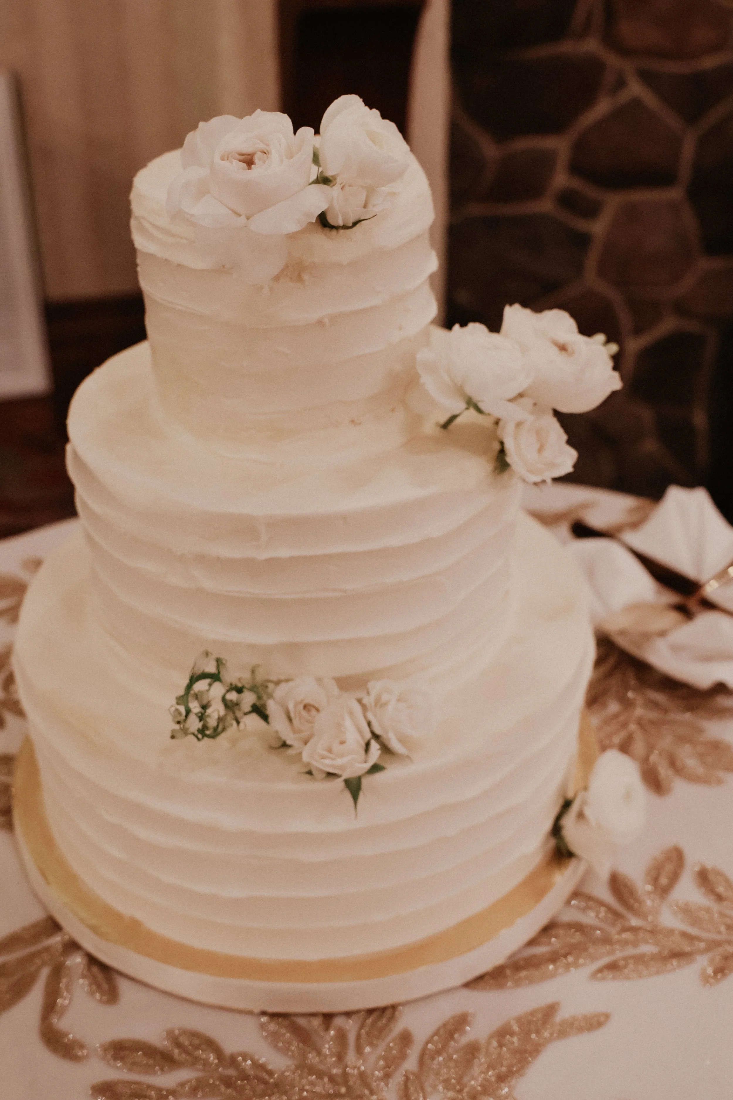 A wedding cake sits atop a holiday table at Cog Hill Country Club in Lemont, IL.