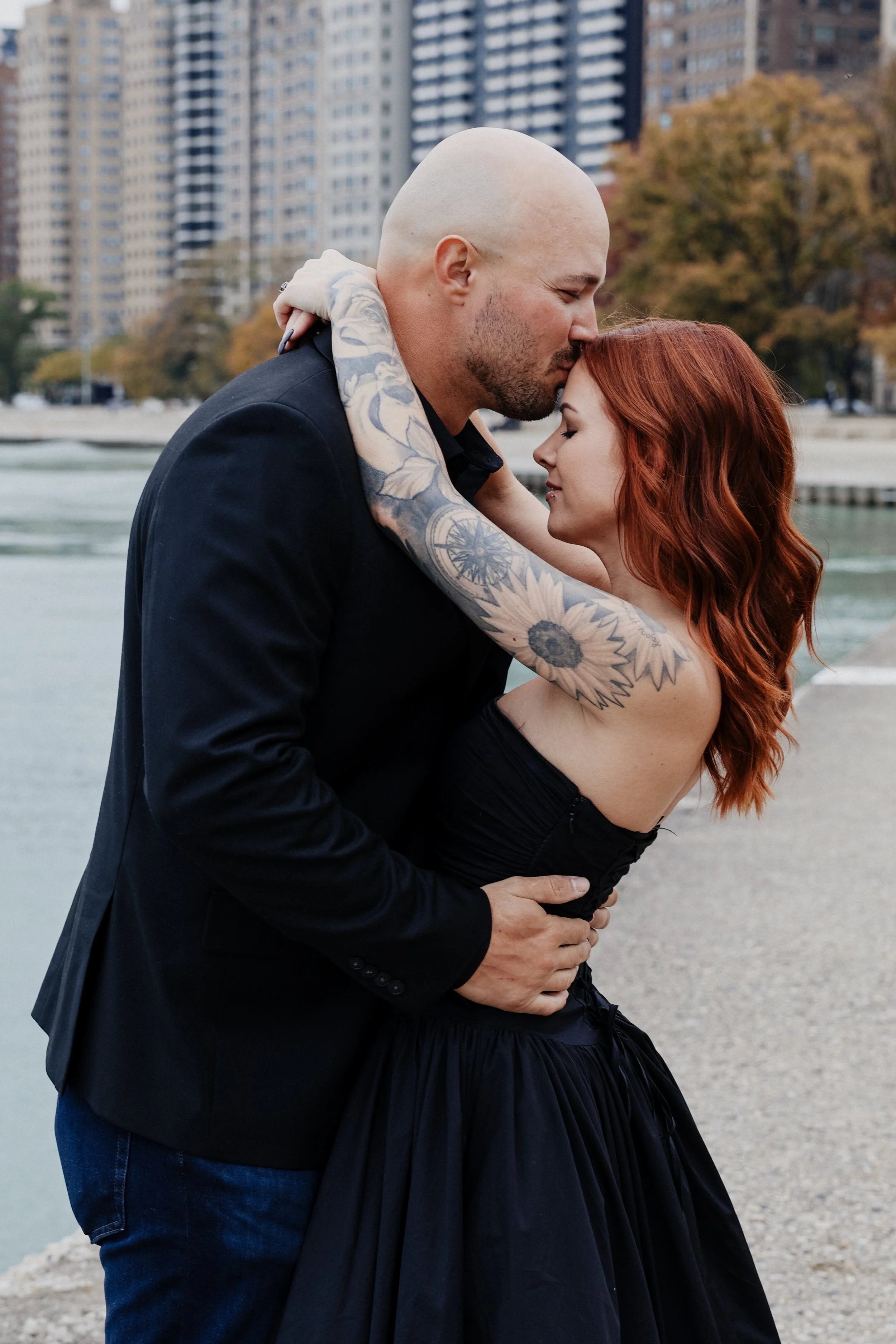 A Chicago couple gets photos taken on the lakefront path.