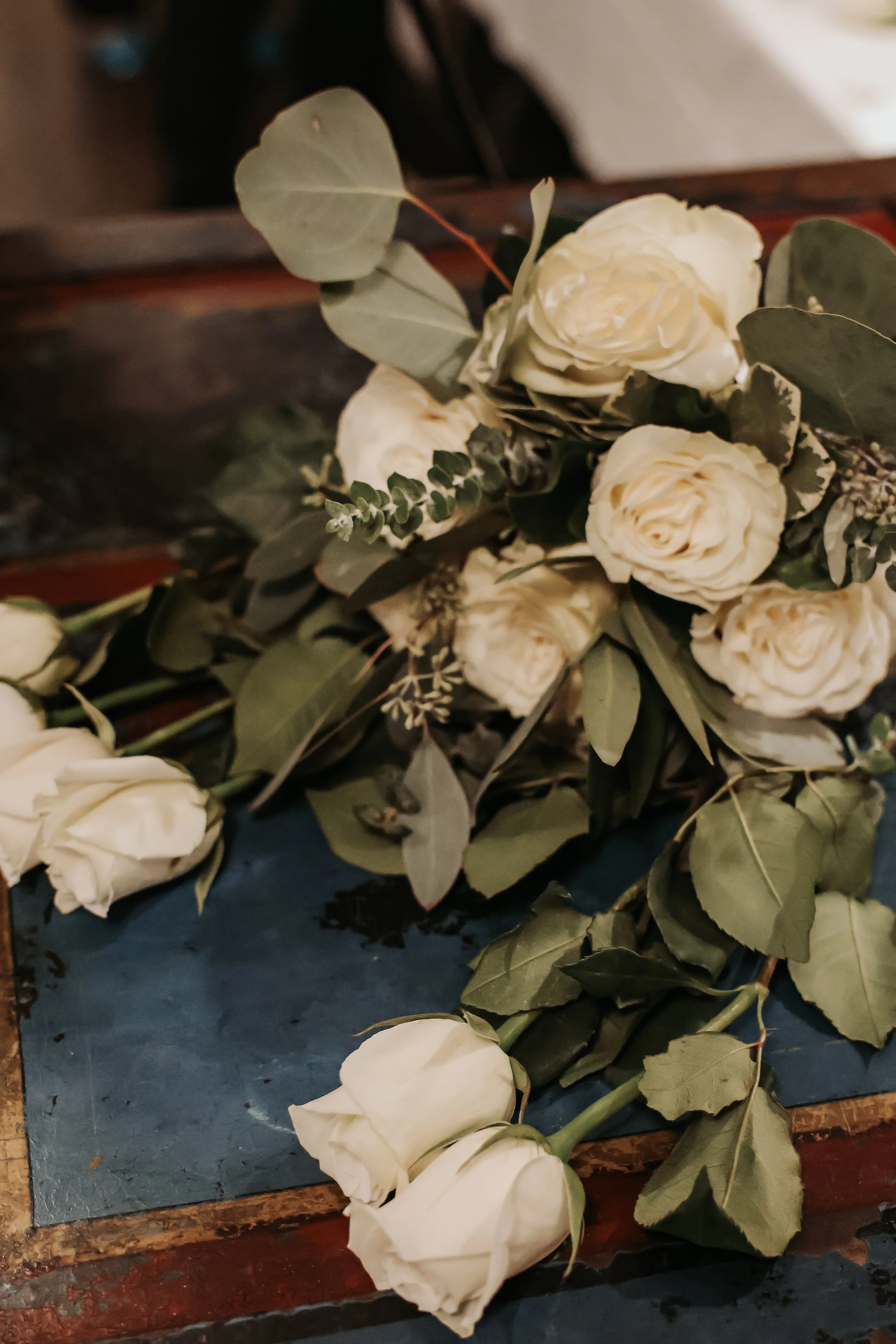 Beautiful white roses and wedding flowers at Eris Brewery and Cider House in Chicago, IL.