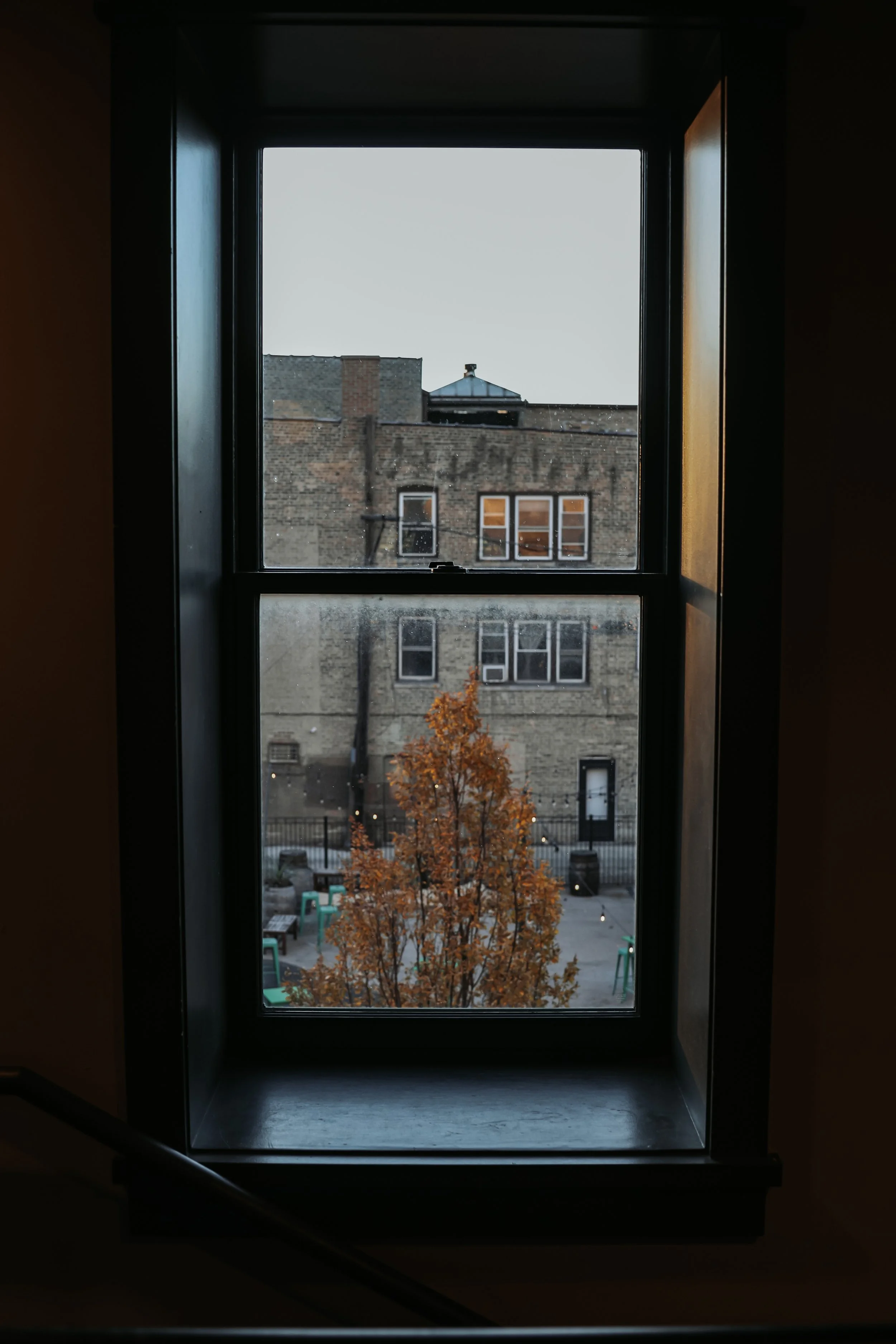 A photo from inside the building shows the courtyard of Eris Brewery and Cider House in Chicago.
