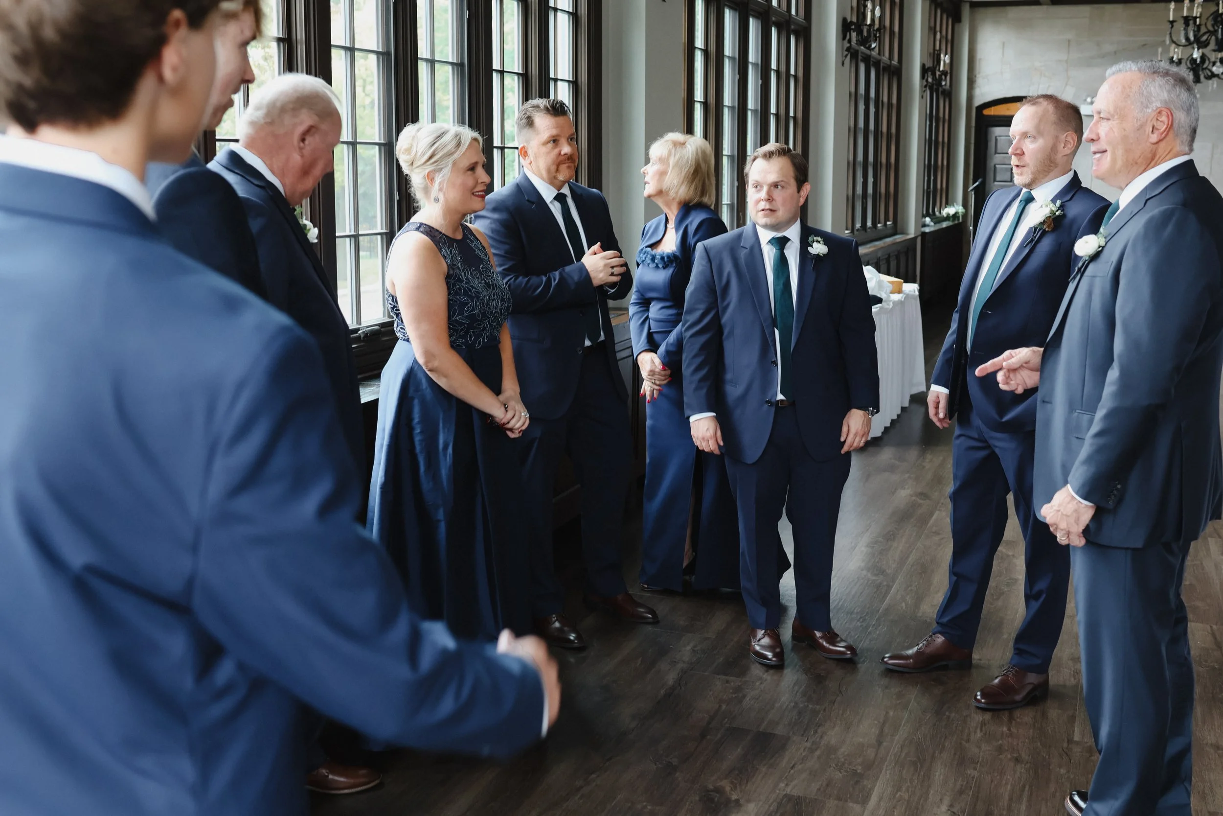 A groom and his wedding party get ready and take candid photos in Michigan Shores Club in Wilmette, IL.