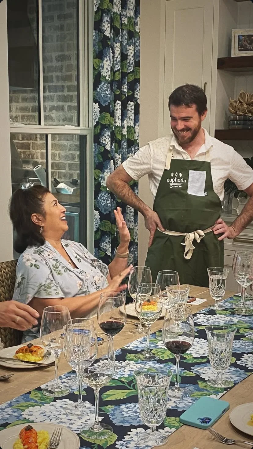 Chef Austyn McGroarty serving guests at a private dinner in Greenville, South Carolina.