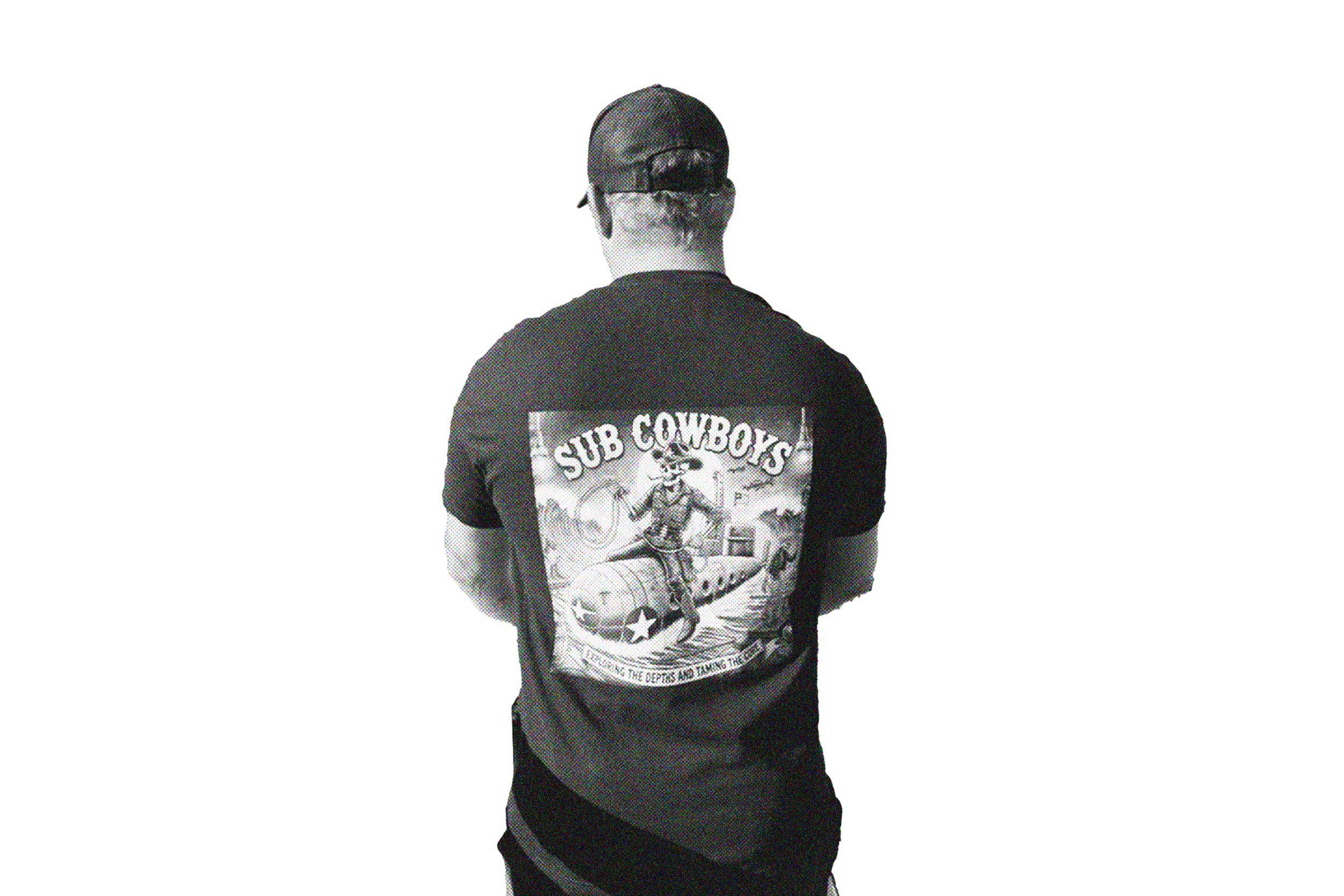 Back view of a person wearing a "Sub Cowboys" T-shirt and a baseball cap.