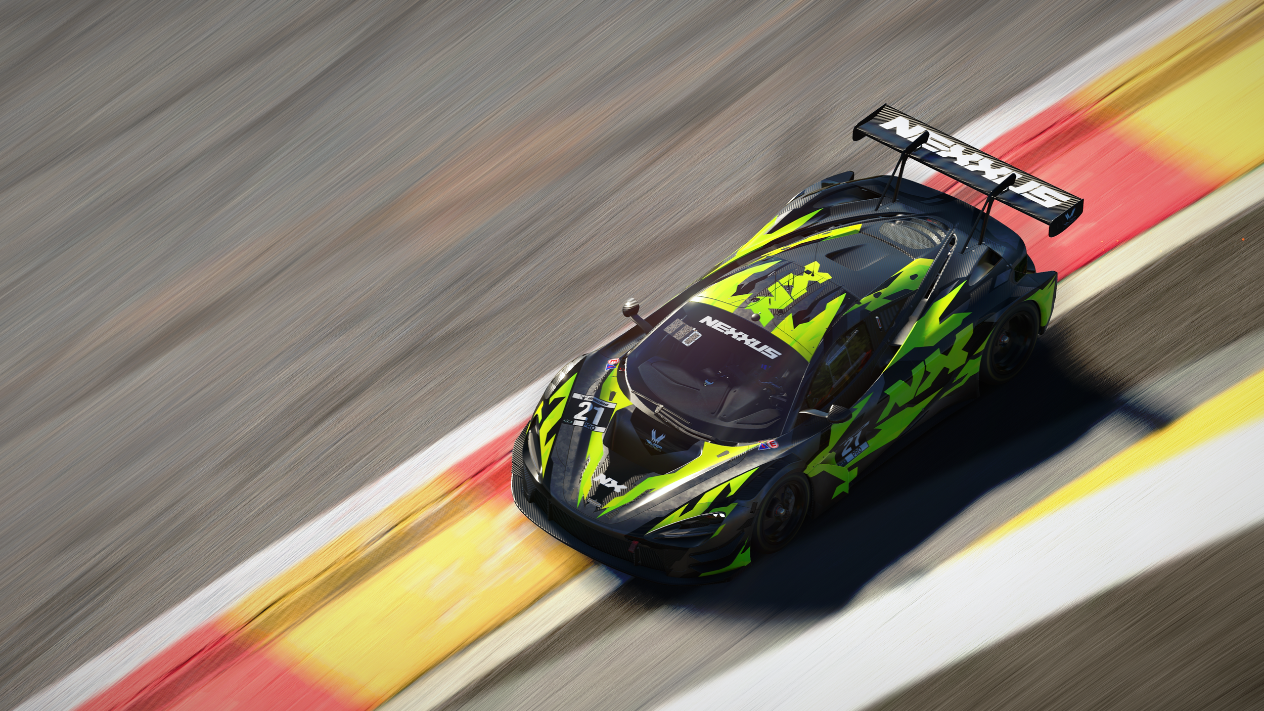 A futuristic race car on a race track, with orange cones in the background. The car is black with blue accents and various sponsor logos, and it has a sleek aerodynamic design.