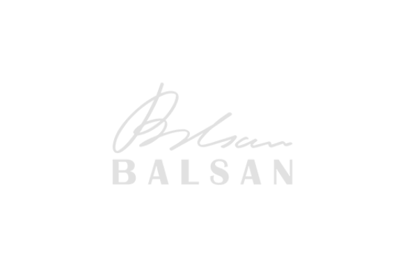 Signature with the name 'BALSAN' below it on a black background.