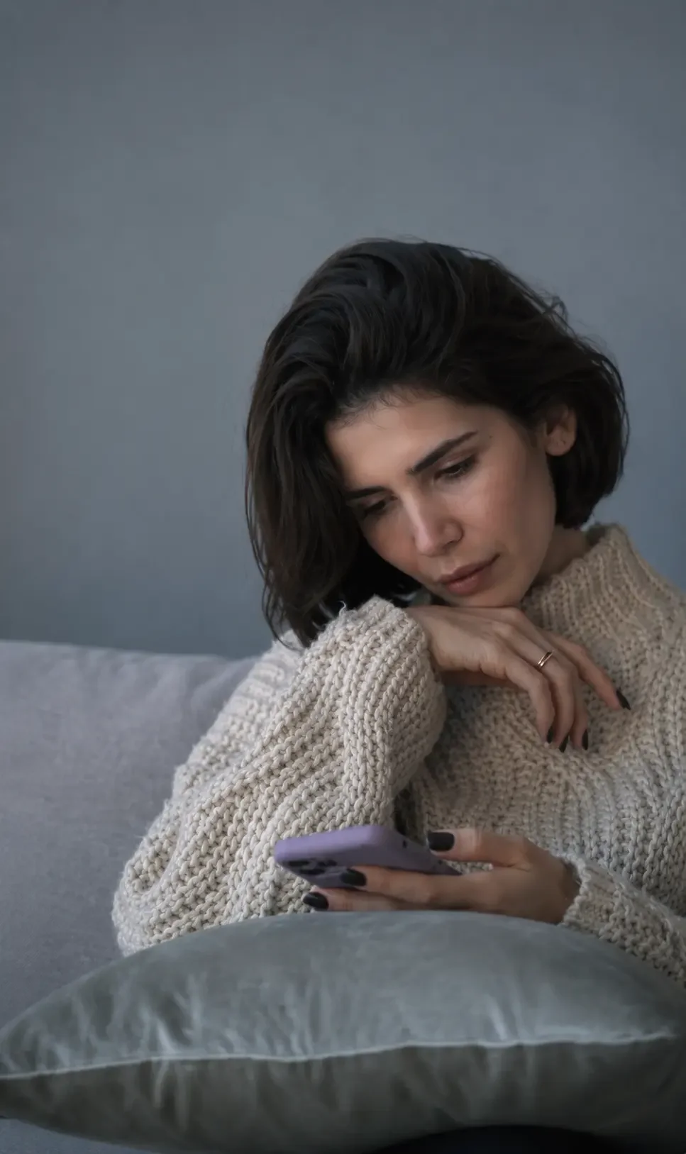 Person reflecting during an online counselling session, representing someone learning to understand why they find it difficult to speak up. Townsville Counselling & Wellness