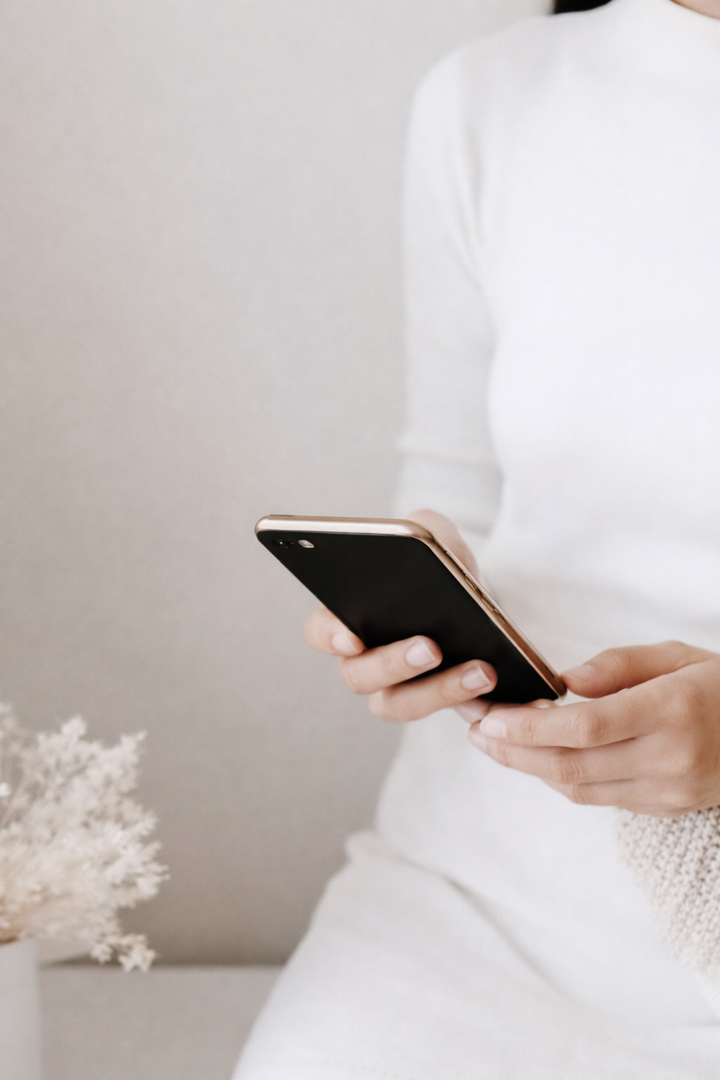 Person holding a phone to enquire about counselling services in Townsville or online across Australia