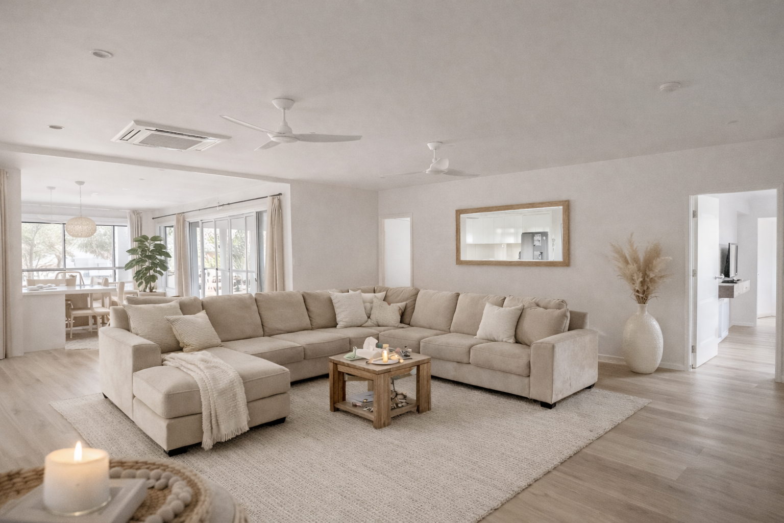 Calm, light-filled living space with neutral tones designed to feel welcoming and relaxed.