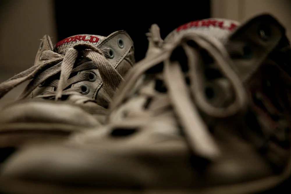 close-up of worn sneakers with laces