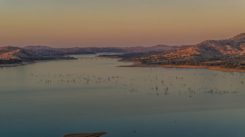 Lake Hume and the Bethanga Bridge under soft sunset light.