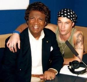 Amos with singer Kamahl in a radio studio