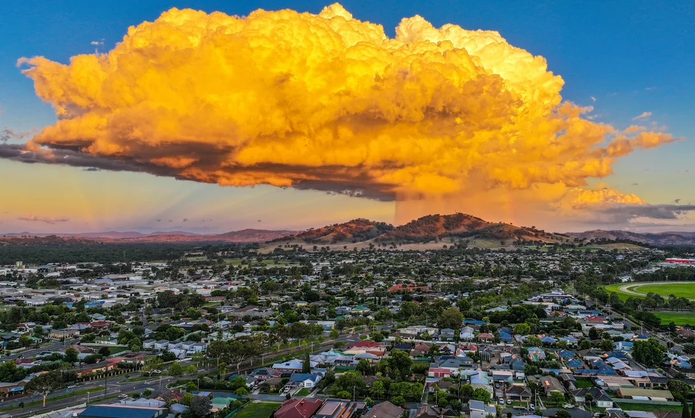 A vivid cloud over a regional landscape