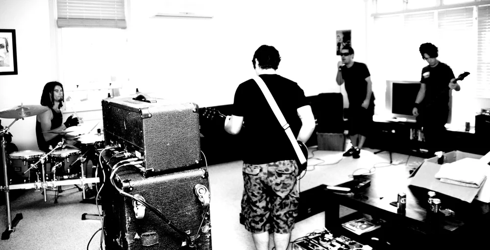 A monochrome view of a band in performance
