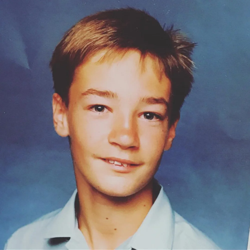 A school portrait of Amos as a child