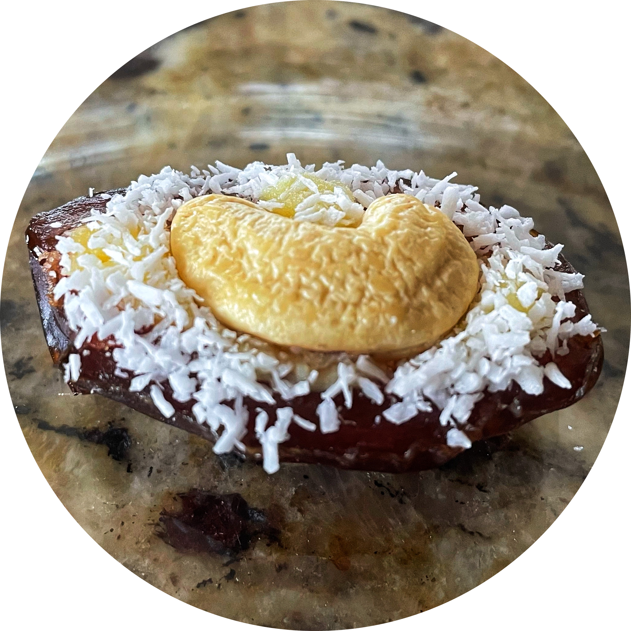 The medjool dates are stuffed with ghee, a cashew and coconut flakes.