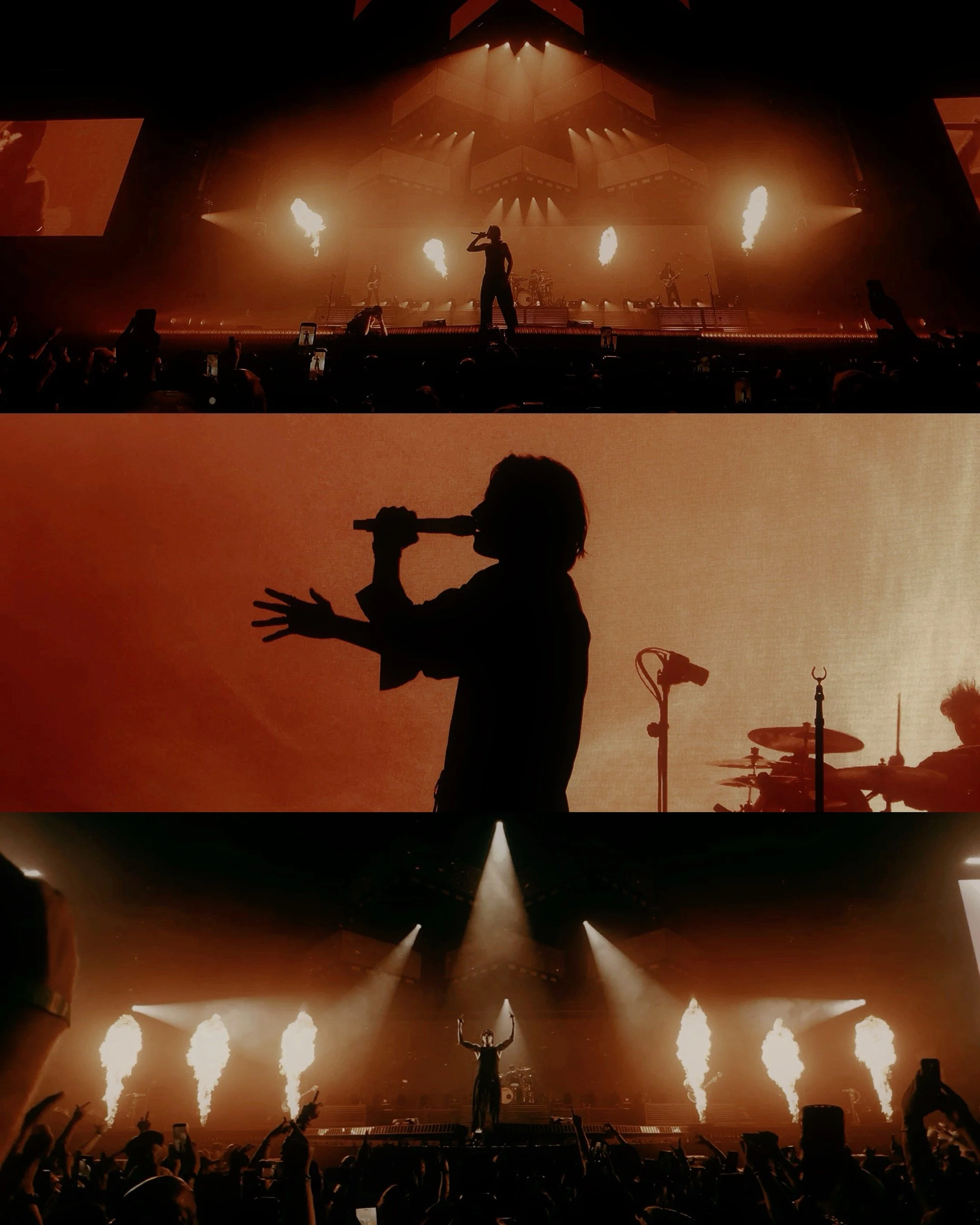 Silhouette of a singer performing on stage with pyrotechnics and lighting effects, followed by another silhouette of a different singer with a microphone, and a third performer at the front with pyrotechnic flames, during a concert.