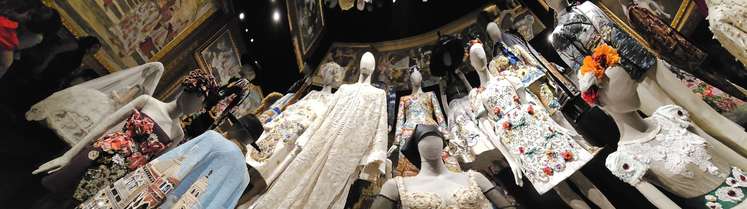 a horizontal panoramic of the outfits on mannequins