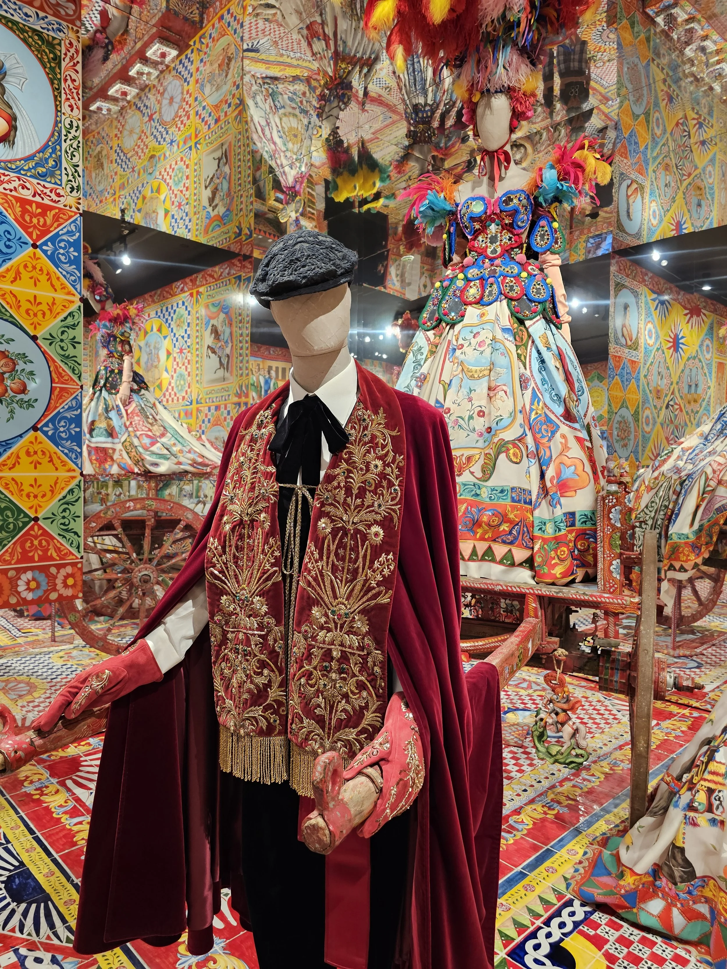 a male outfit with a red cape