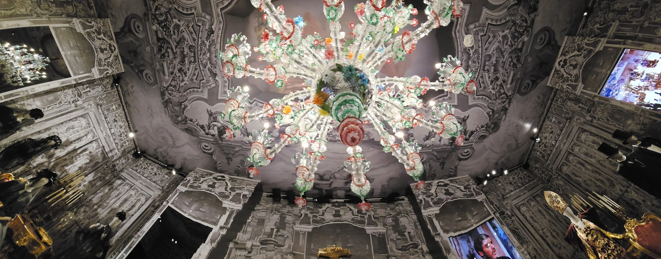 a ceiling with a glass chandelier