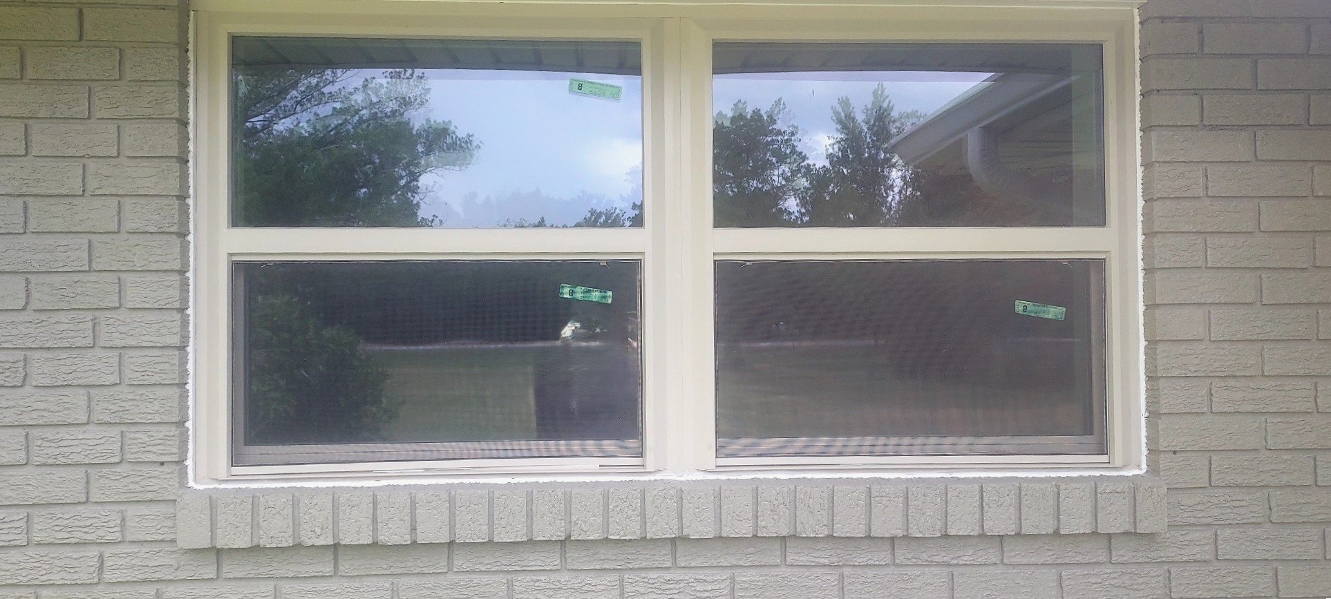 Window installed inside a brick wall.