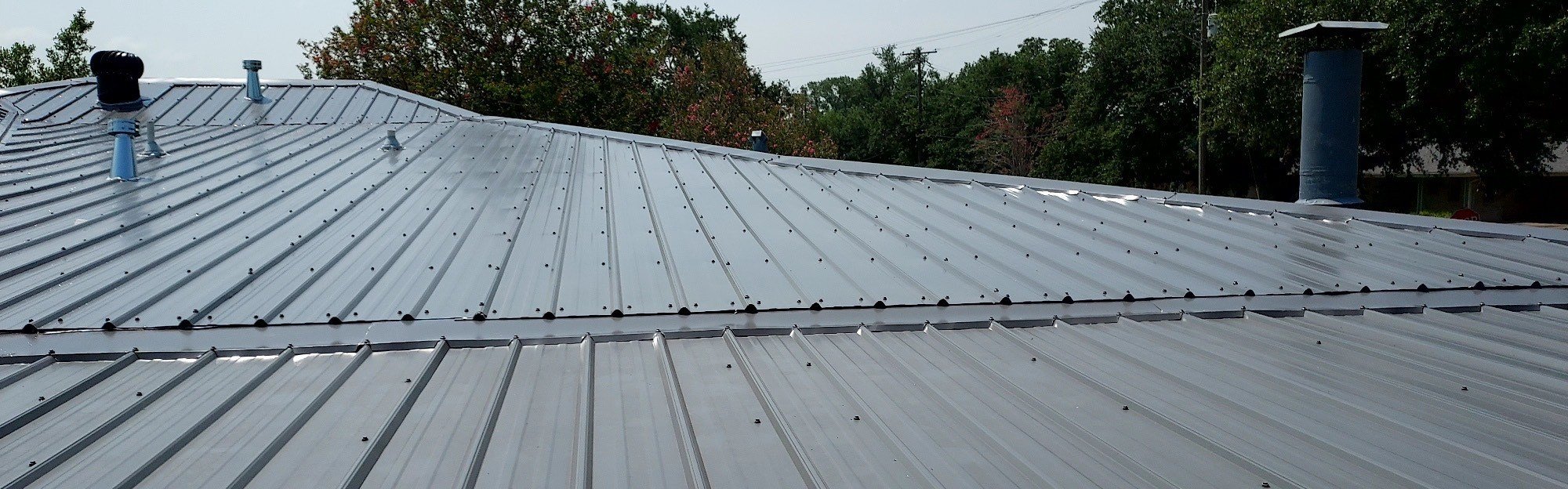 Low profile corrugated metal roofing with transition. Great for applications on flat roofs.