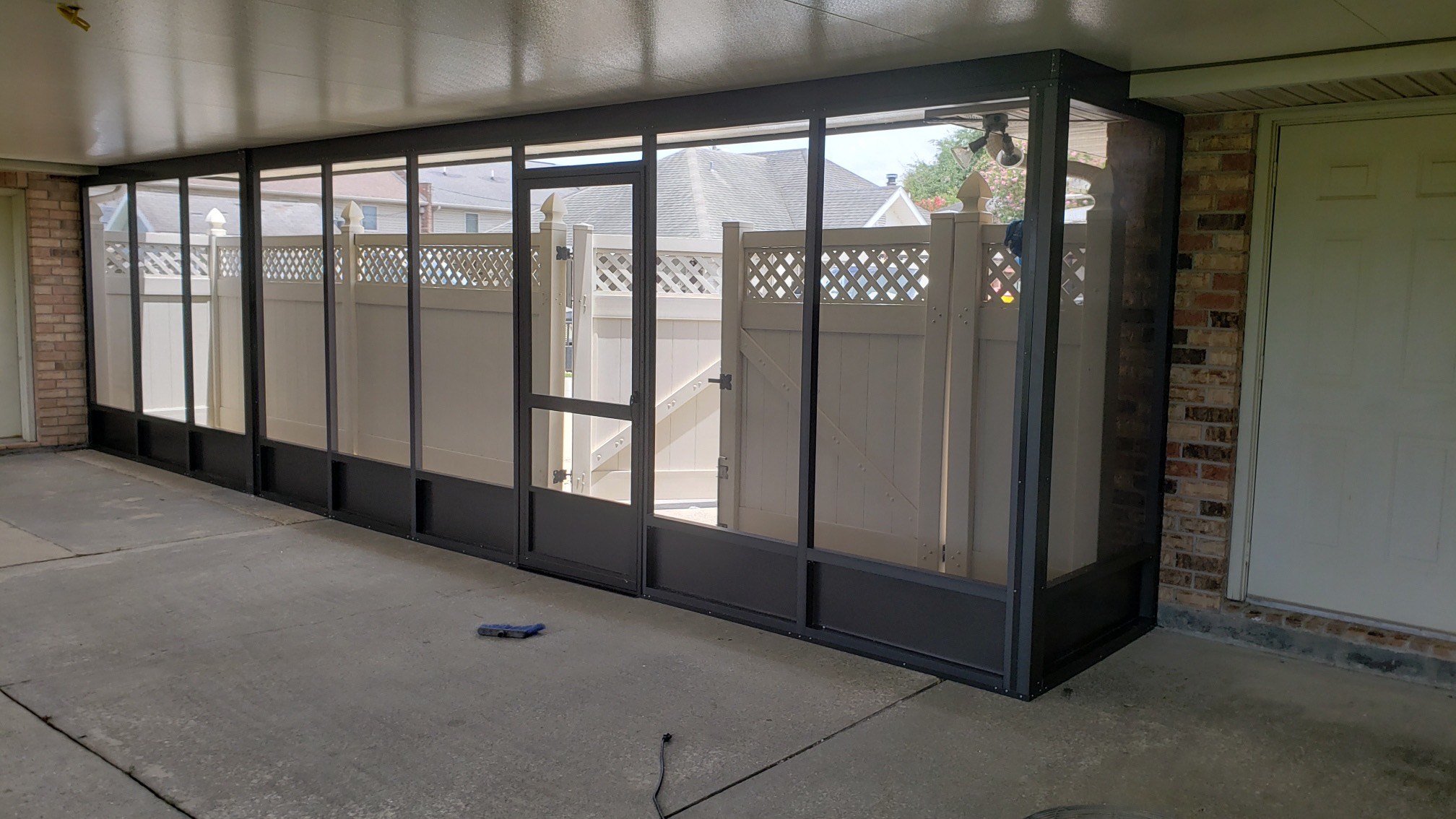 Screen enclosure with an insulated patio cover. (Interior view) (2-4)