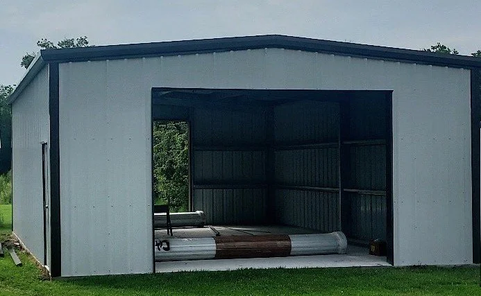 Metal building with corrugated metal roof and walls. (2-2)