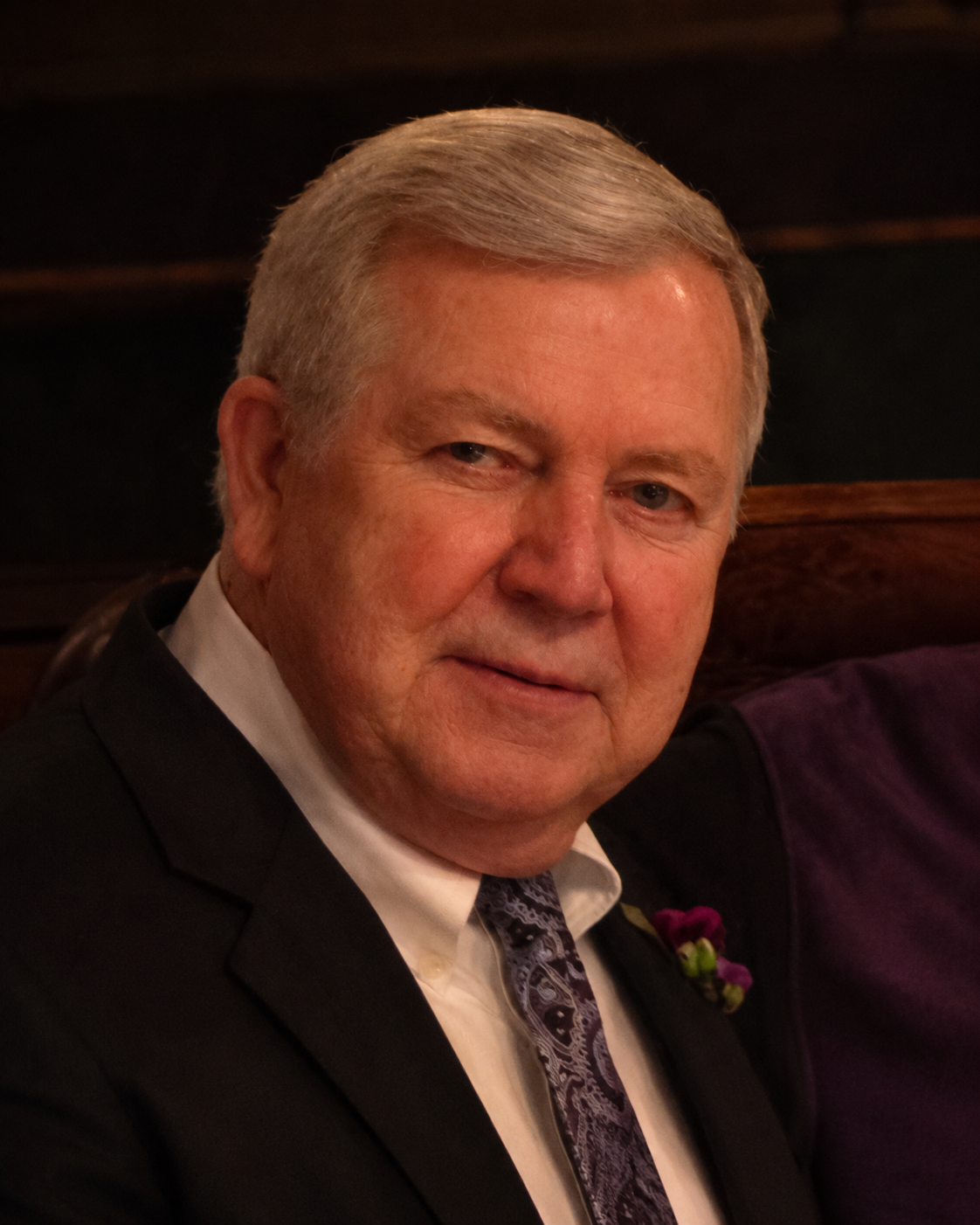 A photograph of Roger May