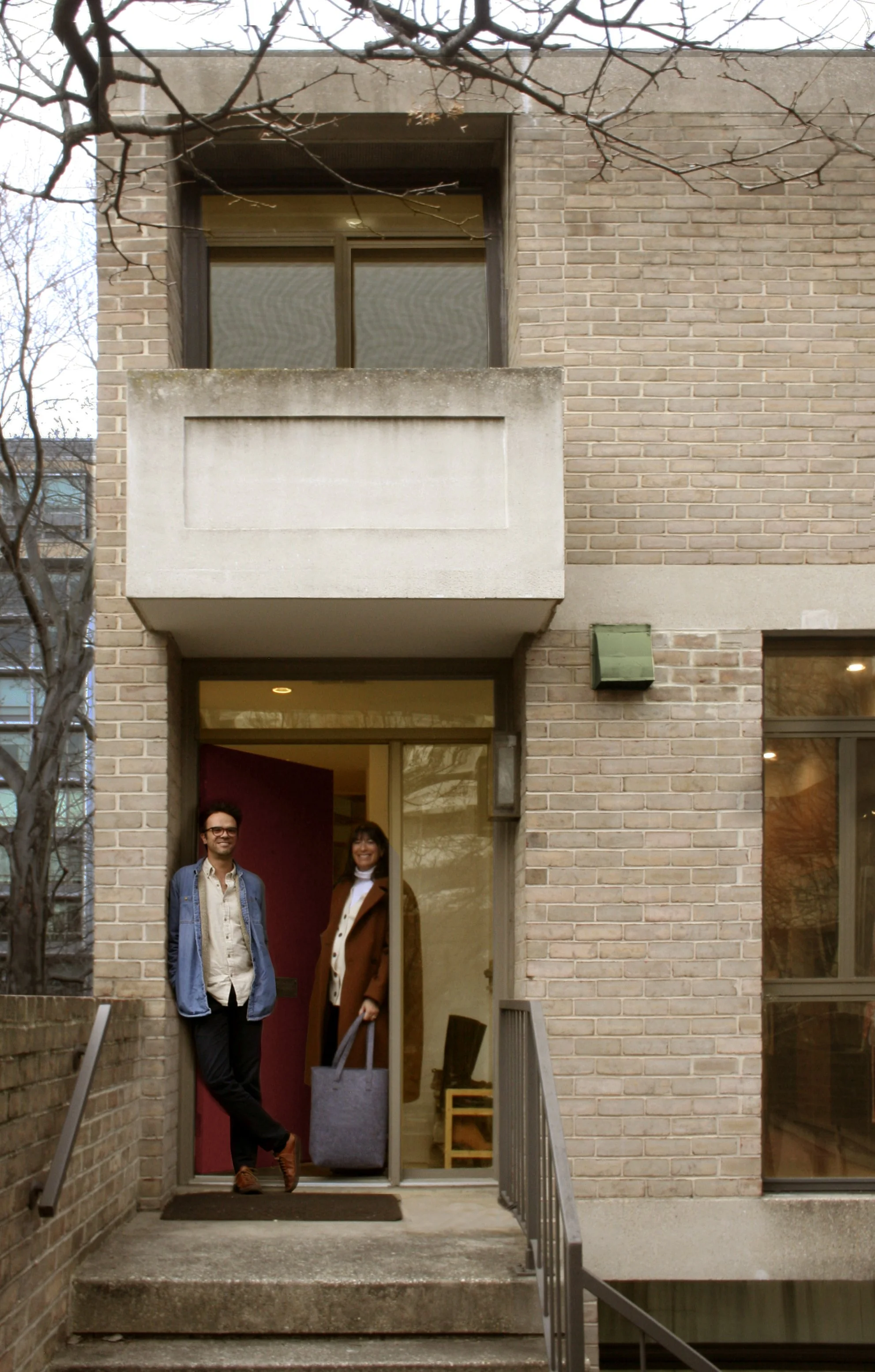 Jeff Gillway and Kim Gittleson at the entrance of the 1962 Brutalist Townhouse in Washington, DC
