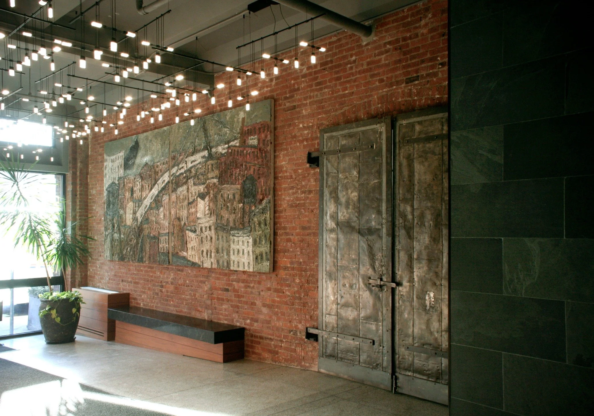 After demolition exposed the concealed &amp; preserved bones of the building, our design concept for Brooklyn's Mill Building condominium shifted to more of a reductive exercise than an additive one. Masonry was sandblasted, windows rebuilt, furred o