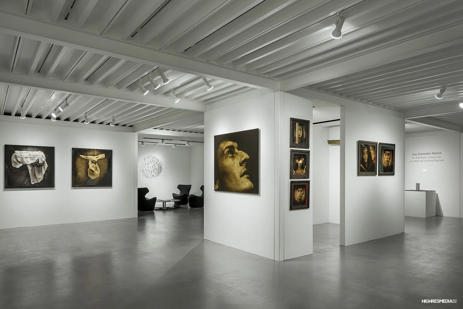 Lisa Sette Gallery interior in Phoenix with white exhibition walls, polished concrete floors, and an exposed metal roof structure