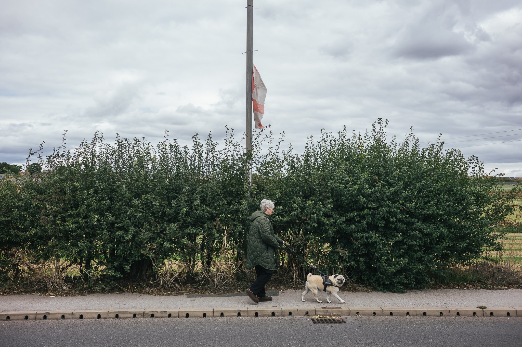 Tattered England flags hang from trees and lamp posts all around Pontefract