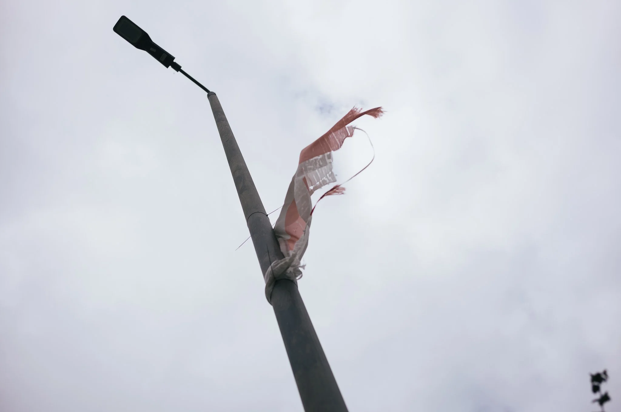 Tattered England flags hang from trees and lamp posts all around Pontefract